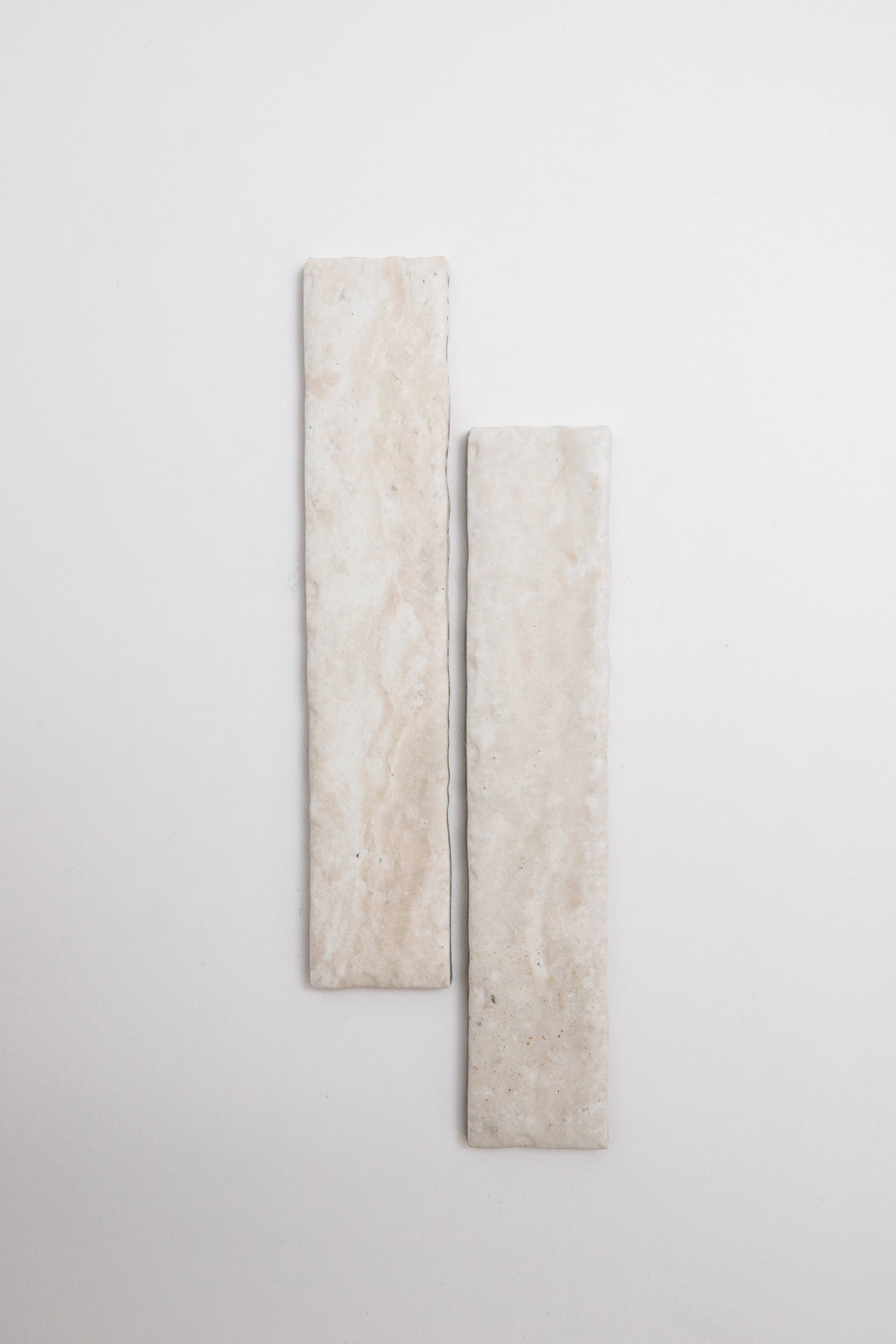 Two rectangular Tosca Travertine tiles shown vertically side by side on a plain white background.