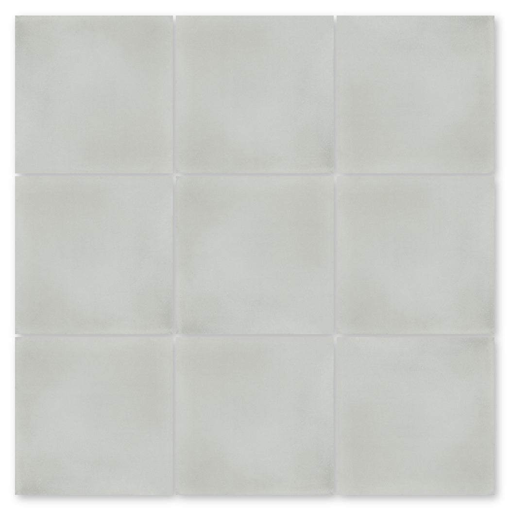 Nine 2219-Solid samples by New York Cement Tile in light gray, arranged 3x3 on a white background.