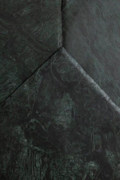 Verde Tia by Tosca features dark green textured surfaces with sharp angles and subtle marbling for a geometric look.