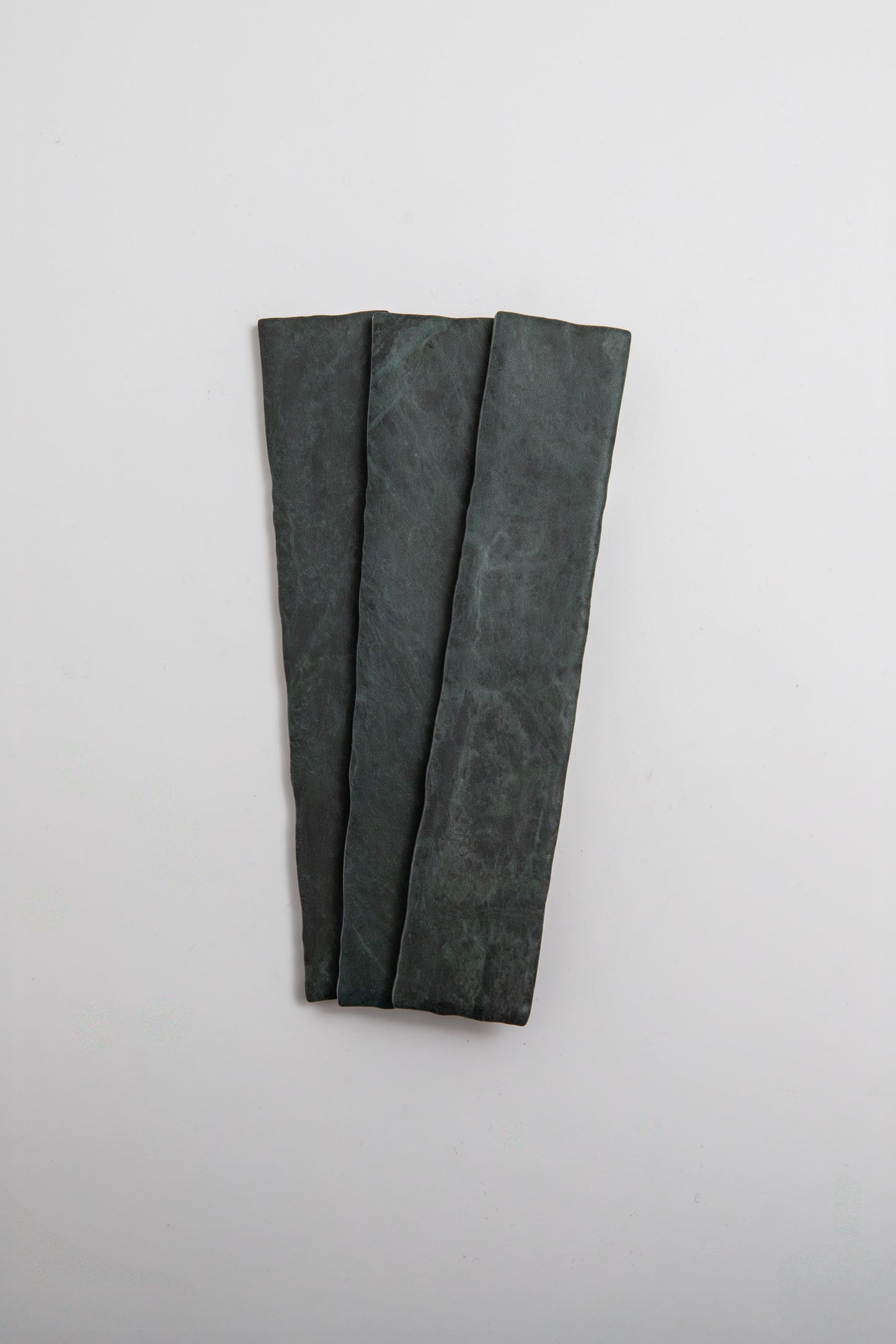 Three Verde Tia rectangular slabs by Tosca are arranged side by side on a plain white background.