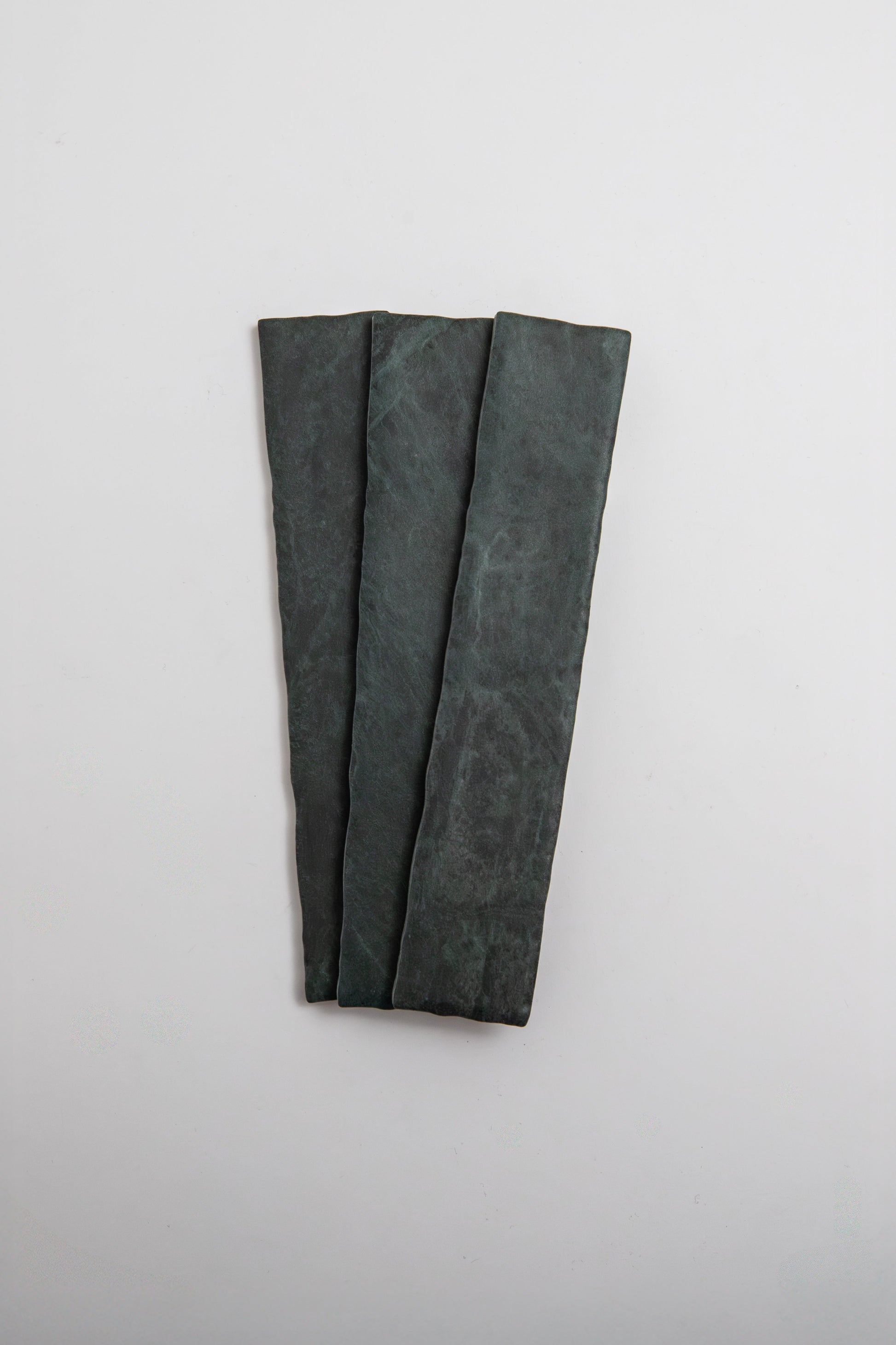 Three Verde Tia rectangular slabs by Tosca are arranged side by side on a plain white background.