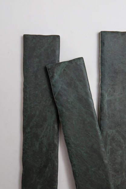 Three Verde Tia slate tile samples by Tosca are arranged vertically on a light background.