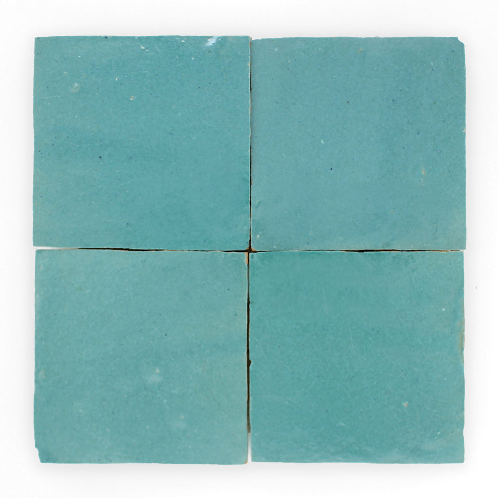 Two-by-two Water line Extra Sample tiles by New York Cement Tile, turquoise on a white background.