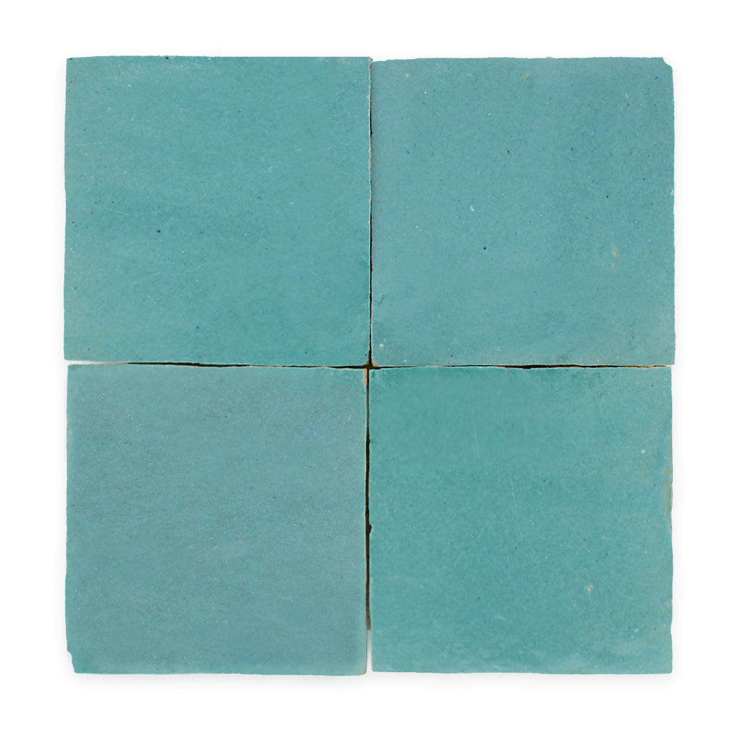 Four square blue tiles arranged in a 2x2 grid on a white background.