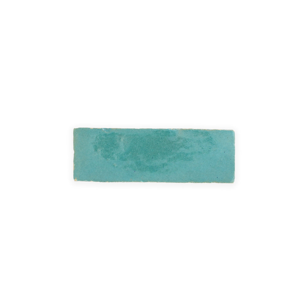A rectangular teal Water line (2x6) tile by New York Cement Tile, slightly uneven, centered on white.