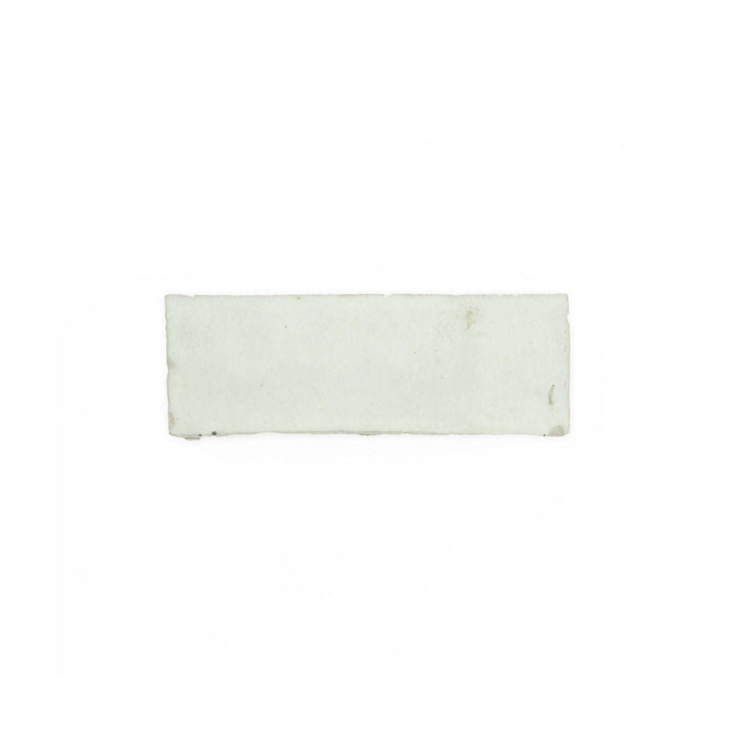 A small, rectangular Mint Frost (2x6) tile sample by New York Cement Tile is centered on a plain white background.